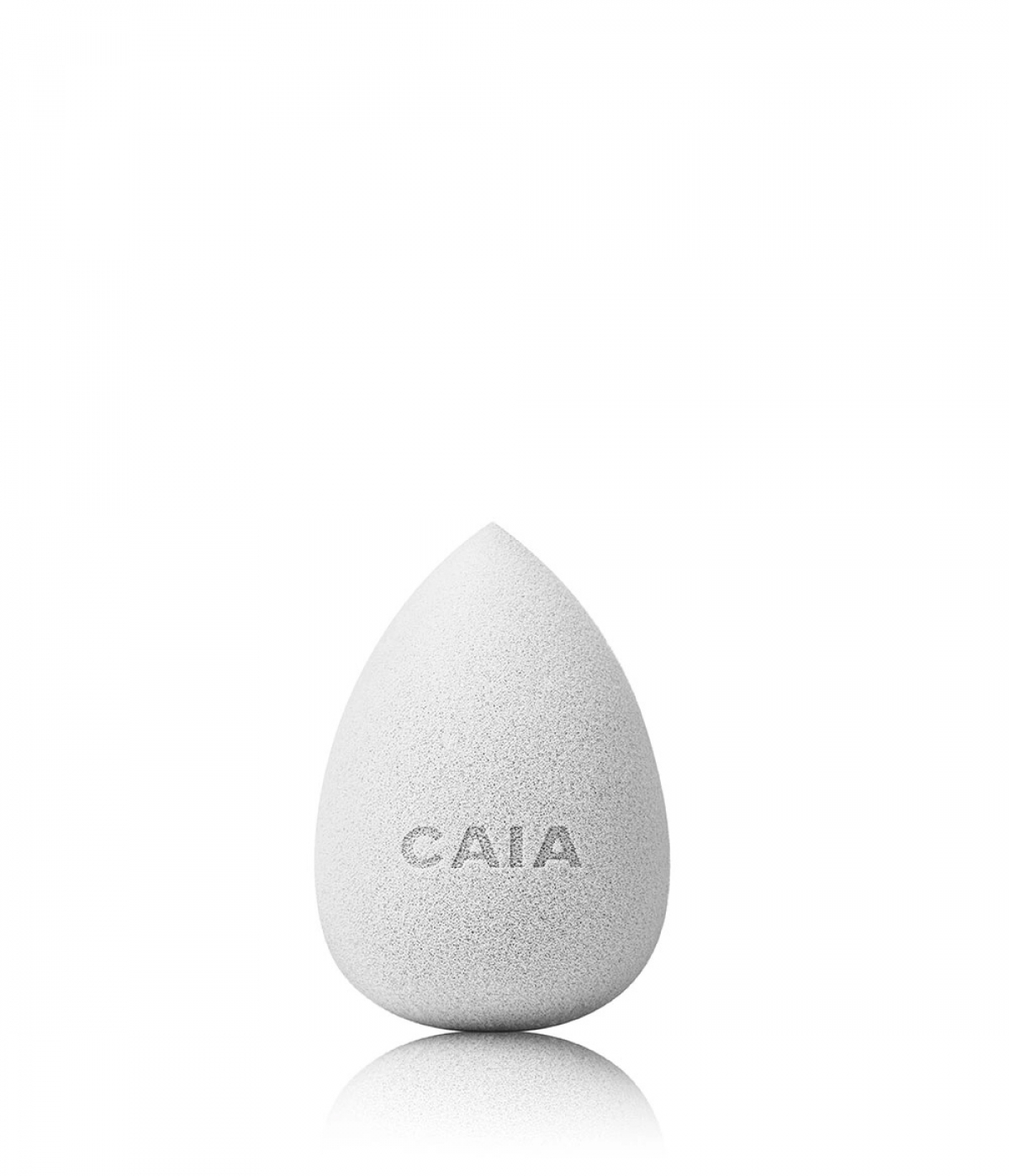 Makeup sponge applicator shown in a clean professional beauty setting